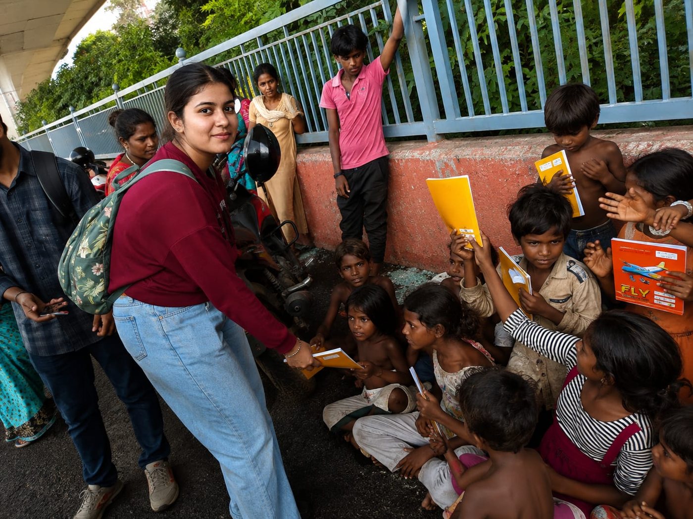 Handing study material to children